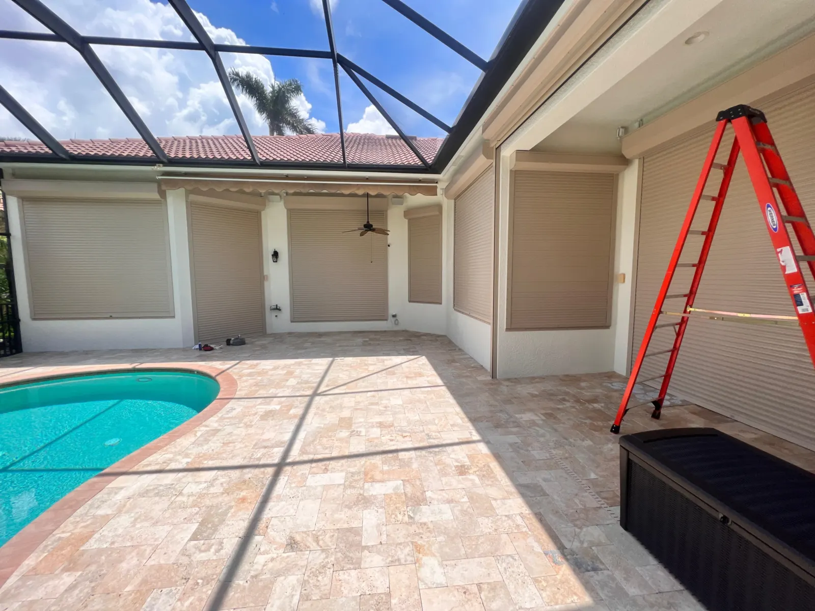 Hurricane roll-down shutter protecting a large exterior opening